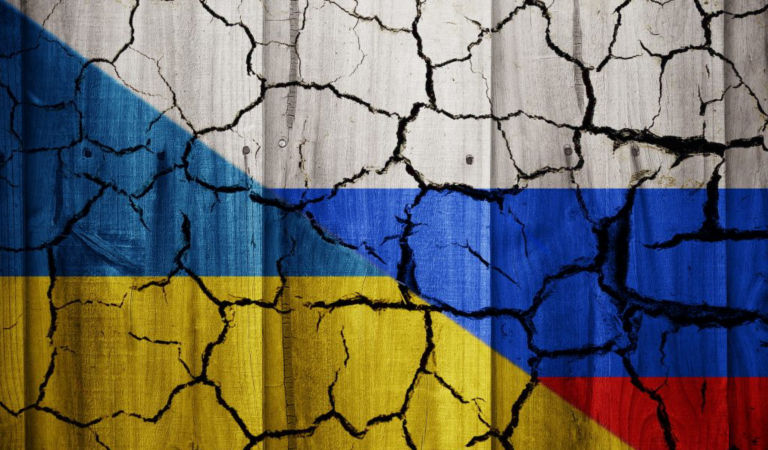 1031043360-ukraine-russia-flags-cracked-wall-1024x733