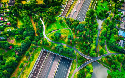 Drone photo of a green bridge park highway in the Netherlands