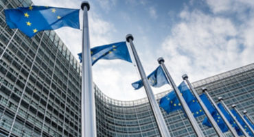 European Union flags waiving at Berlaymont building of the European Commission in Brussels, Belgium