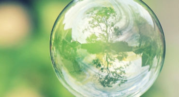 glass ball which shows trees and lake 50877762 1500x410