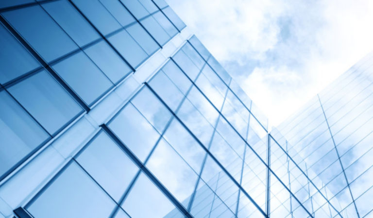 glass building with sky with sun