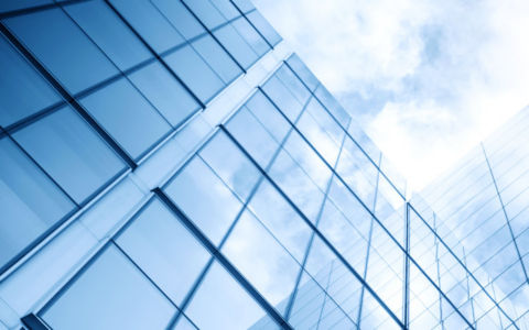 glass building with sky with sun