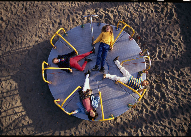 kids on roundabout gettyimages 523373338