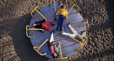 kids on roundabout gettyimages 523373338