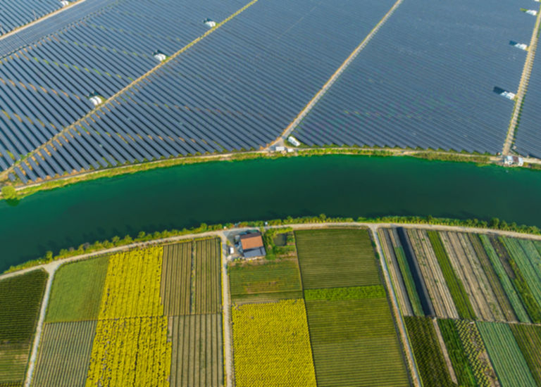 Solar panels, river and fields