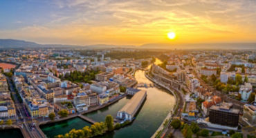 Geneva, Switzerland skyline view over the river at sunset