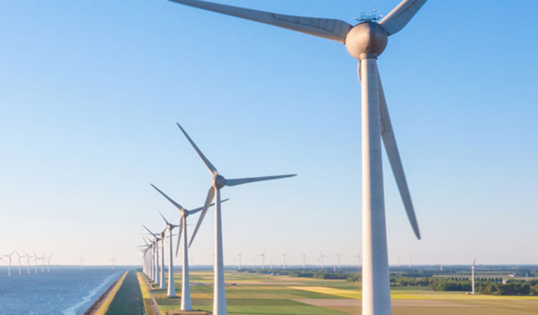 Wind mills on river bank