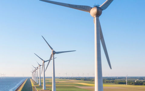 Wind mills on river bank