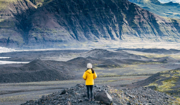 woman-standing-between-mountains