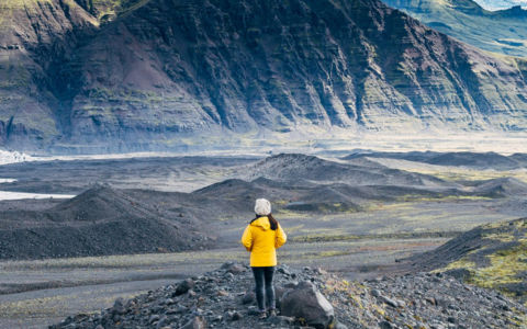 woman-standing-between-mountains