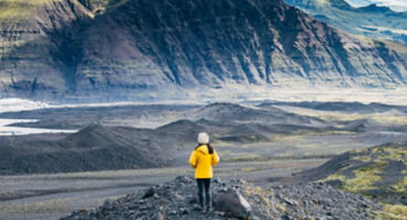 woman-standing-between-mountains