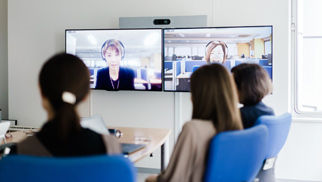 women watching presentation
